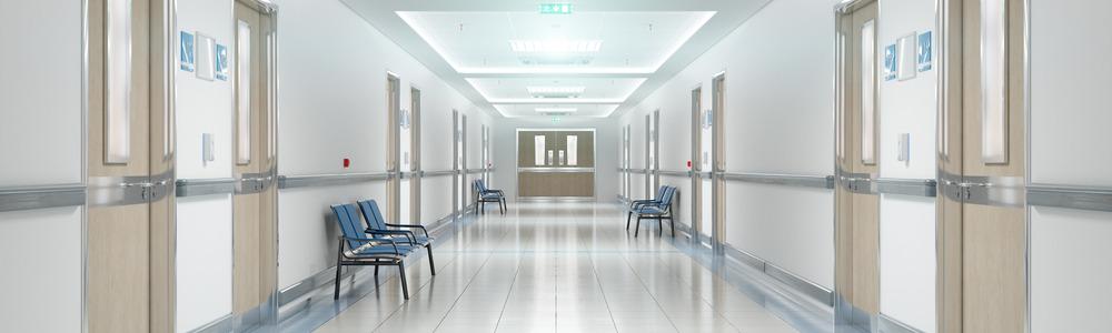 A hospital corridor with lots of doors.