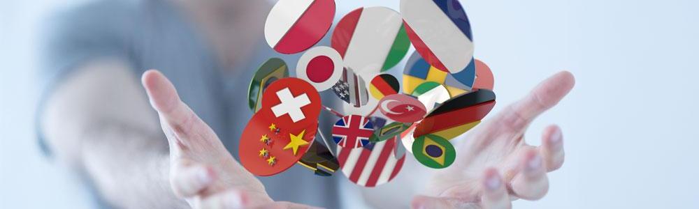 Multilingual concept art of person holding many countries' flags