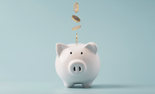 A piggy bank with coins falling in it