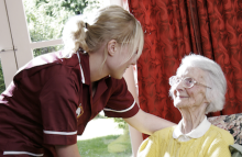 A carer looking after a patient
