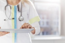 A doctor with an electronic tablet