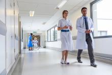 Doctors walking down hospital corridor