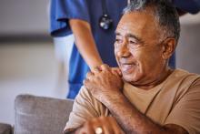 Senior man receiving support from a nurse