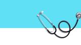 A stephoscope on a white and blue background.