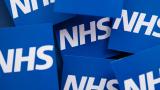 A collection of big blue blocks saying 'NHS.'