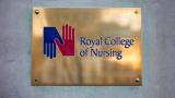 A plaque with the Royal College of Nursing emblem.