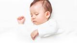 Baby sleeping on white background.