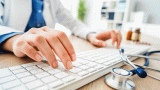 Doctor typing on a keyboard.