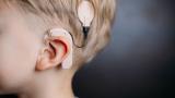 Young boy with cochlear implant