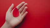 Person holding blood drop