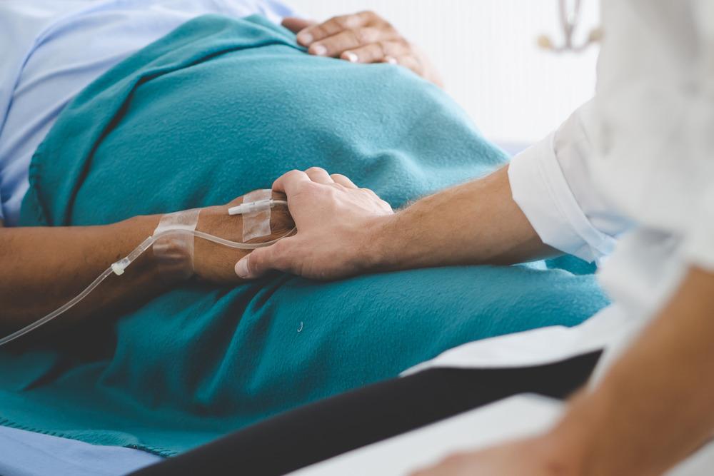 A patient being held.