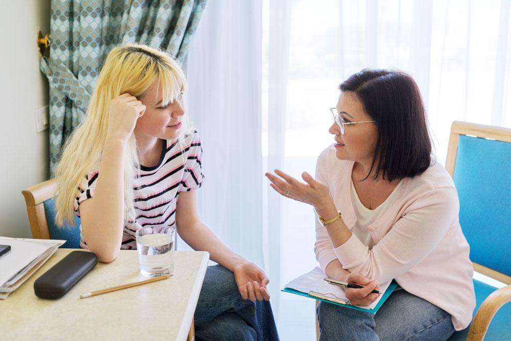Youth worker speaking to a teenager