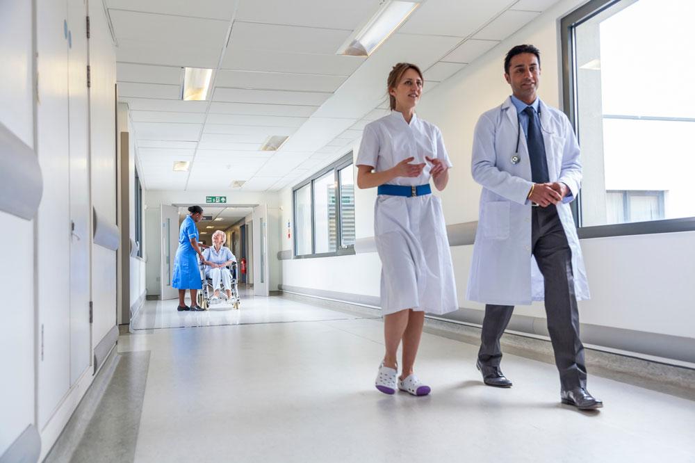 Doctors walking down hospital corridor