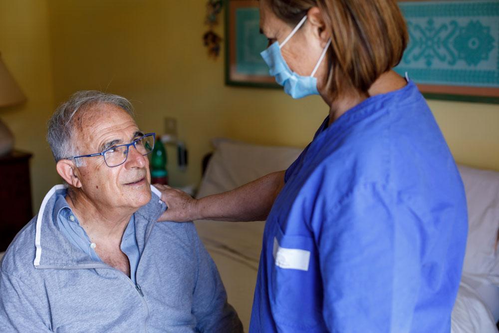 Senior man being treated at home