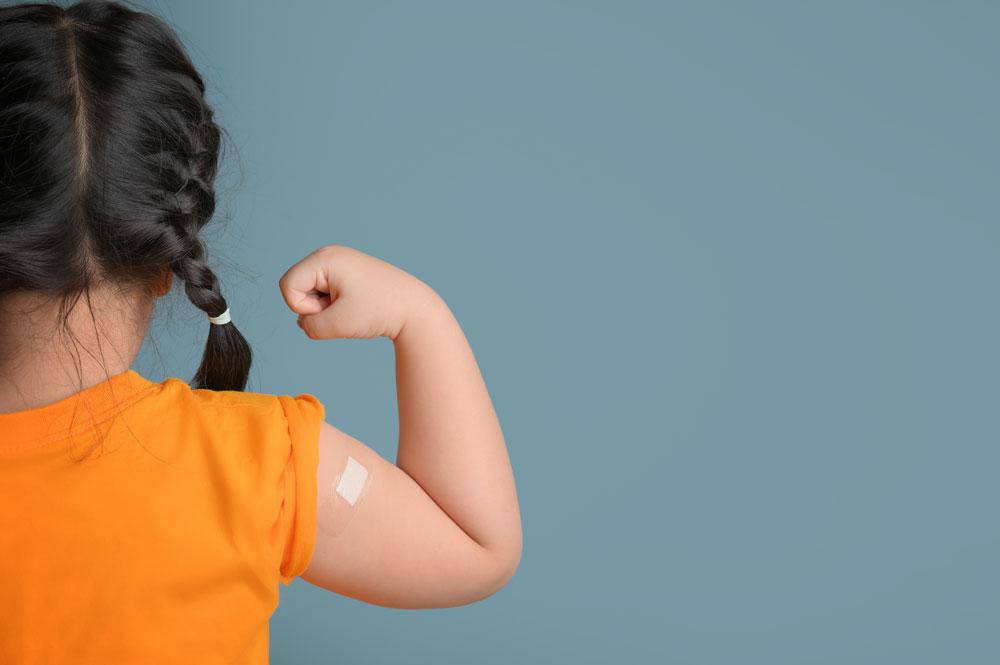 Child with a plaster on their arm